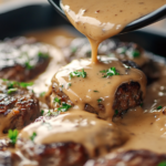 Gravy over Amish hamburger steak bake