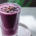 acai smoothie recipe in a jar with blueberries and banana